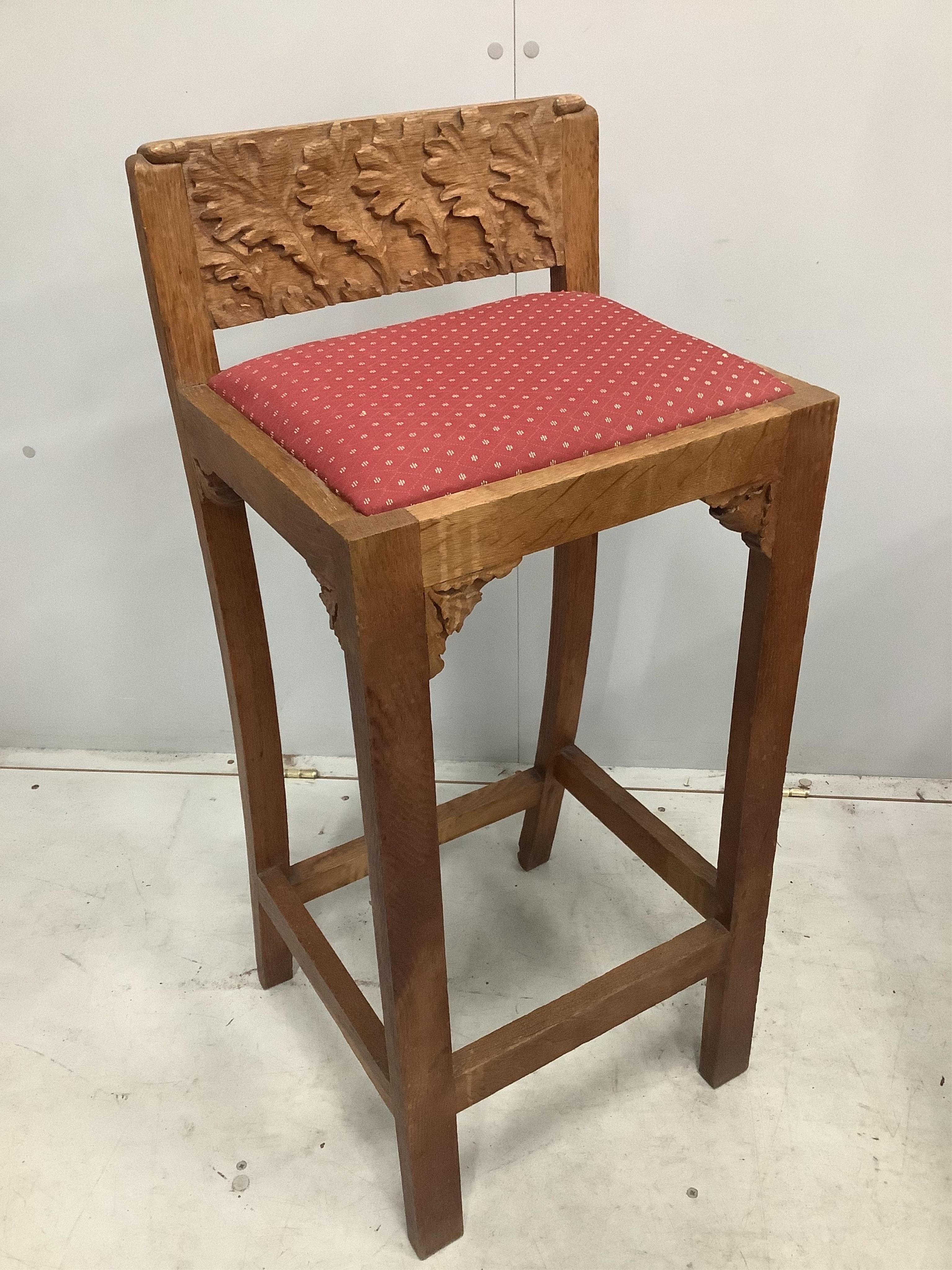 An Arts & Crafts oak clerk's chair, width 38cm, depth 31cm, height 90cm, together with a pine three drawer pedestal chest. Condition - fair